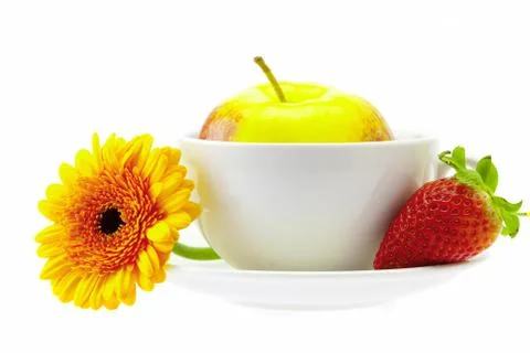 Apple in a cup, strawberry and flower isolated on white Stock Photos