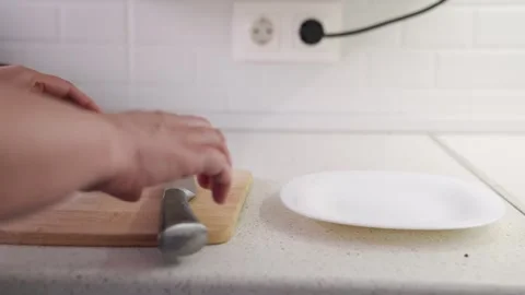 Apple cut on a cutting board, Red apple ready to eat, Preparing fruit for a meal Stock Footage 311896412