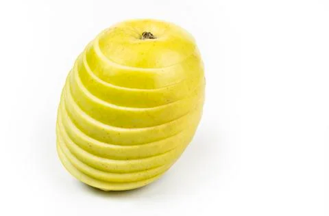 Apple cut on thin slices on the white background Stock Photos