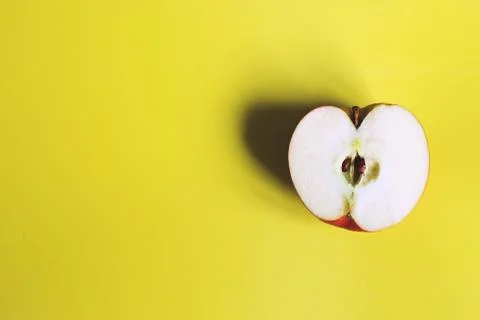 Apple cut on a yellow background. half apple Stock Photos