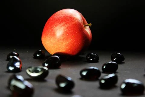 An apple in a dark background Stock Photos