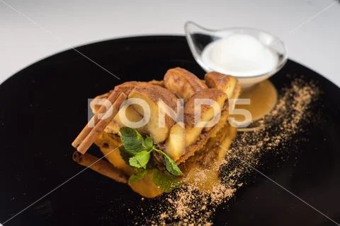 Apple dessert with cinnamon and ice cream Stock Photos