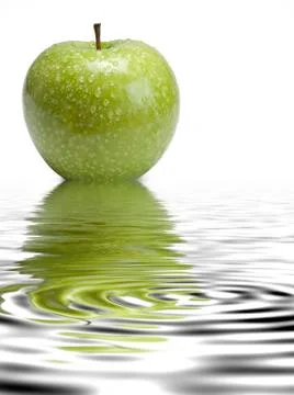 Apple with dew droplets. Stock Photos