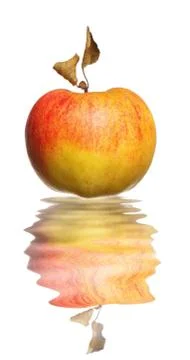 Apple with dried leaf reflection in water 스톡 사진