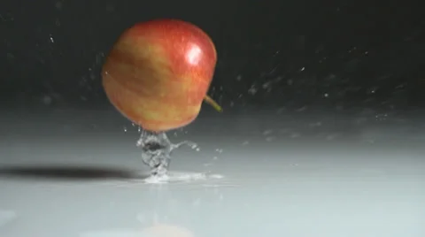 Apple dropping down in slow motion Stock Footage 24736723