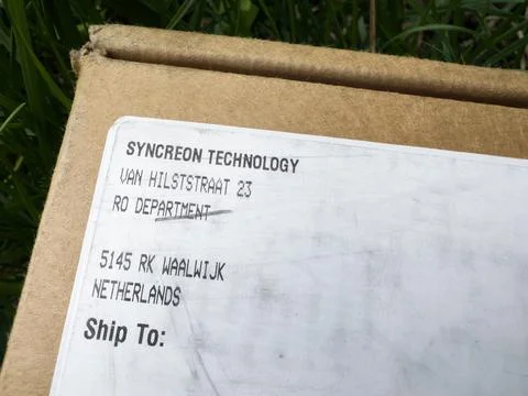 Apple e-shop Store delivery parcel with address of Syncreon Technology on van Stock Photos