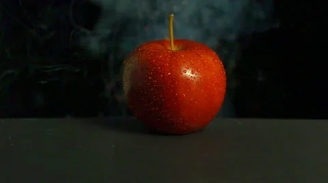 An apple exploding, close-up Stock Footage 11282203