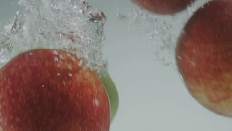 Apple falling in water Stock Footage 98299953
