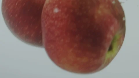 Apple falling in water Stock Footage 98300140