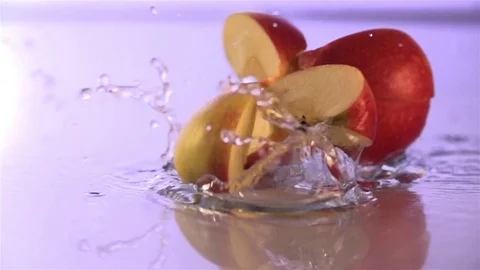 Apple  falling  On the water surface Stock Footage 76437176