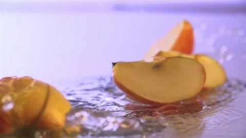 Apple  falling On the water surface Stock Footage 76437178