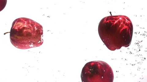 Apple falling in water on white background Stock Footage 236746945