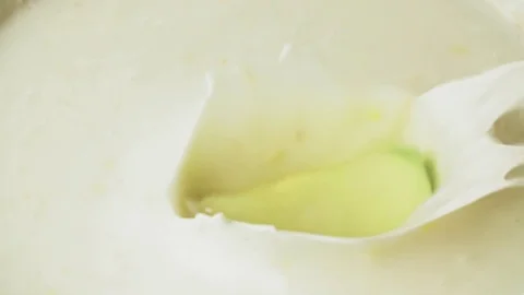 Apple falling to yogurt full hd slow motion close up video Fruit drops splash Stock Footage 83937420