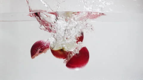 Apple falls into water in slow motion 001 Stock Footage 67889149