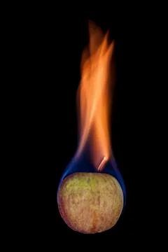 Apple on fire Stock Photos