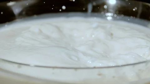 Apple floating into milk, Ultra Slow Motion Stock Footage 86577548