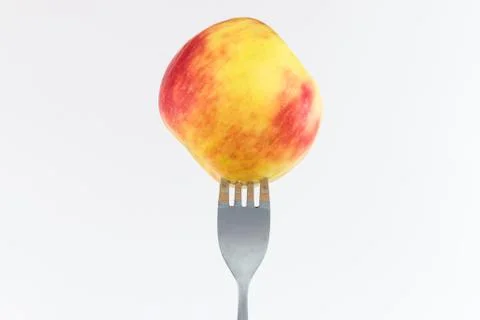 Apple on a fork 스톡 사진