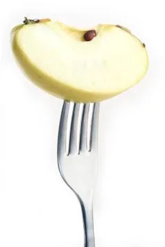 Apple on fork Stock Photos