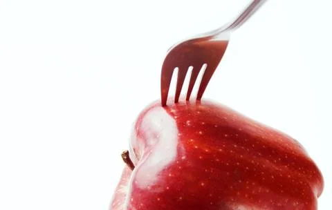 Apple with a fork stuck Foto stock