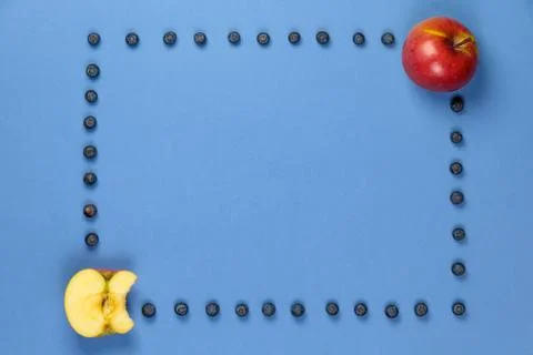 Apple with frame of blueberries Stock Photos