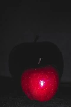 Apple fruit, abstract shadow, black background Stock Photos