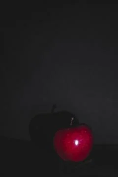 Apple fruit, abstract shadow, black background Stock Photos
