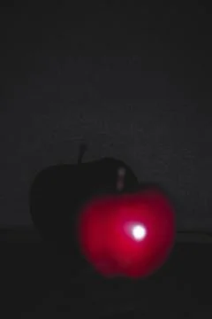 Apple fruit, abstract shadow, black background Stock Photos