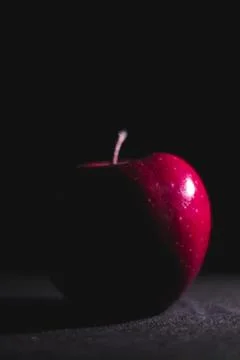 Apple fruit, abstract shadow, black background Stock Photos