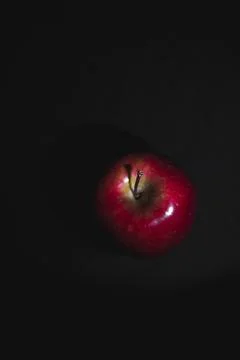 Apple fruit, abstract shadow, black background Stock Photos