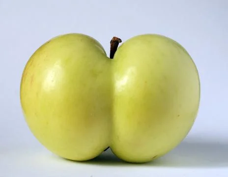 Apple of a funny shape Stock Photos