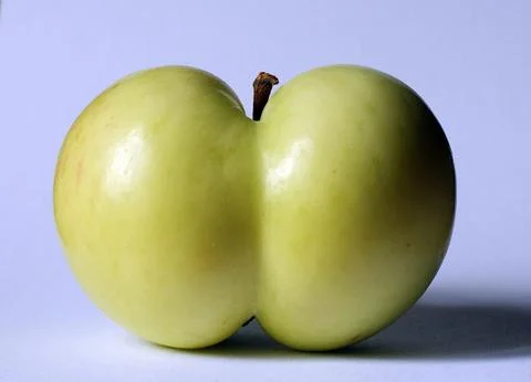 Apple of a funny shape Stock Photos