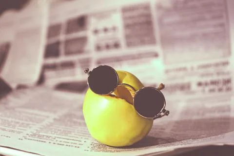 Apple with glasses Stock Photos