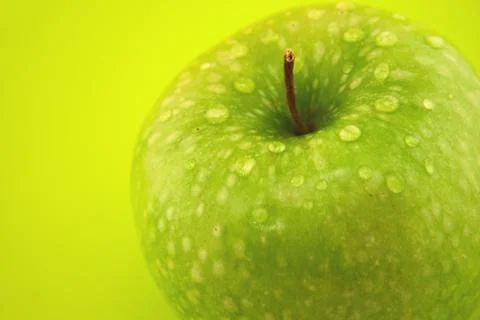 Apple on a green background Stock Photos