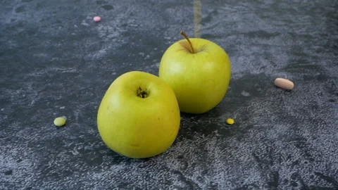 Apple group vs many different pills, concept Video stock 148766878