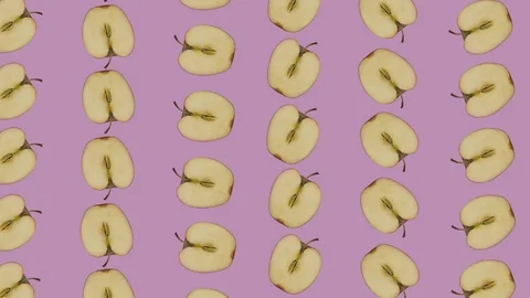 Apple Halves Floating on Pink Background 2 库存影片 112925389