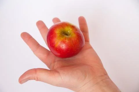 Apple in hand Stock Photos