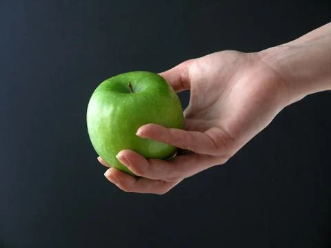 Apple in hand Stock Photos