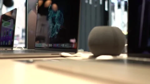 Apple Home mini and MacBook Pro with the all new M2 chip in the store Stock Footage 240193787
