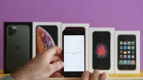Apple ID Setup on Red iPhone SE Stock Footage 298727737