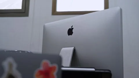 Apple iMac computer in office workspace Stock Footage 336643887