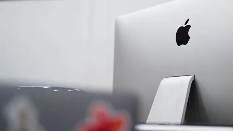 Apple iMac desktop computer in modern office workspace Stock Footage 336643822