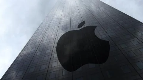 Apple Inc. logo on a skyscraper facade reflecting clouds. Editorial 3D rendering Stock Illustration