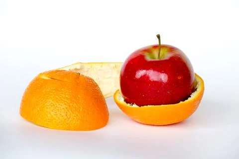 Apple inside an orange Stock Photos