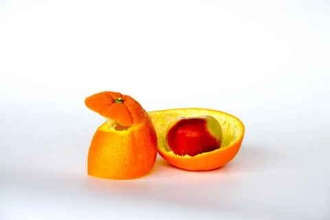 Apple inside the orange Stock Photos