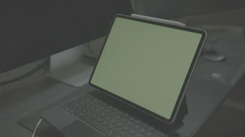 Apple iPad Pro 12.9 inch with Magic Keyboard, green screen rotating 動画素材 256073401