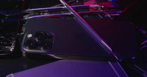 Apple iPhone 13 Pro with tools for repair. Fixing damaged Smartphone Stock Footage 237437816