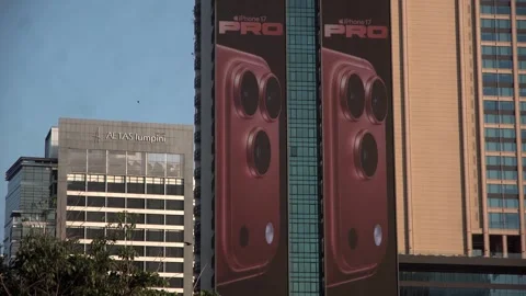 Apple iPhone 16 advertisement screen on a building in Bangkok, Thailand. Видео 342422144