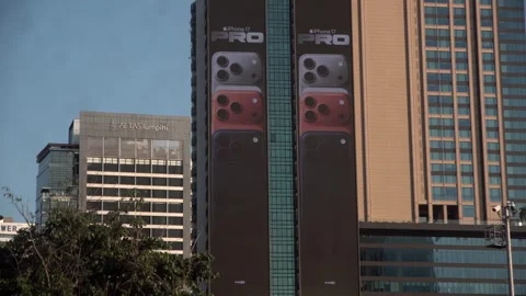 Apple iPhone 16 advertisement screen on a building in Bangkok, Thailand. Видео 342437370