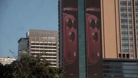 Apple iPhone 16 advertisement screen on a building in Bangkok, Thailand. Видео 342437371