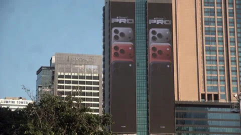 Apple iPhone 16 advertisement screen on a building in Bangkok, Thailand. Stock Footage 342437707